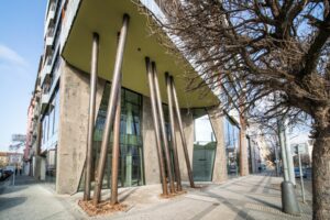 Entrance to the multifunctional house Holport 2 with a facade of shotcrete